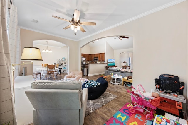 5149 Morning Frost Pl, Myrtle Beach, SC 29579 - living area with arched walkways, ceiling fan, wood finished floors, crown molding, and a chandelier
