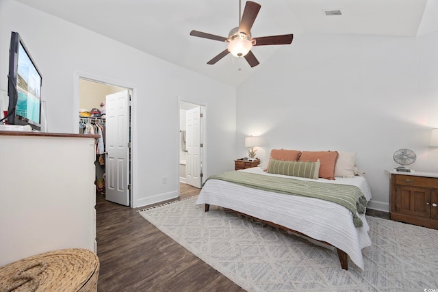 5149 Morning Frost Pl, Myrtle Beach, SC 29579 - bedroom with a spacious closet, vaulted ceiling, wood finished floors, baseboards, and a ceiling fan