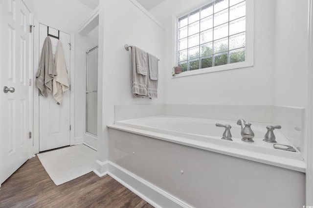 5149 Morning Frost Pl, Myrtle Beach, SC 29579 - bathroom with a garden tub, a shower stall, wood finished floors, and baseboards