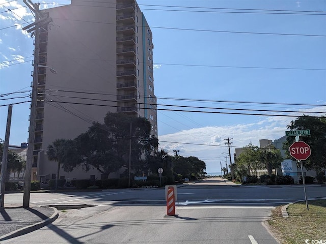 3000 N Ocean Blvd Unit 1406, Myrtle Beach, SC 29572 - view of asphalt road featuring traffic signs