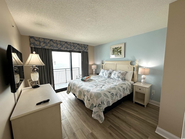 3000 N Ocean Blvd Unit 1406, Myrtle Beach, SC 29572 - bedroom with access to exterior, a textured ceiling, wood finished floors, and baseboards