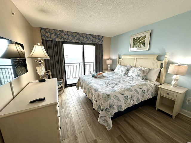 3000 N Ocean Blvd Unit 1406, Myrtle Beach, SC 29572 - bedroom featuring access to outside, wood finished floors, and a textured ceiling