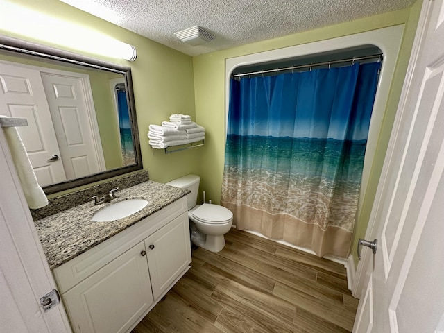 3000 N Ocean Blvd Unit 1406, Myrtle Beach, SC 29572 - full bath with vanity, toilet, a textured ceiling, wood finished floors, and shower / bath combination with curtain