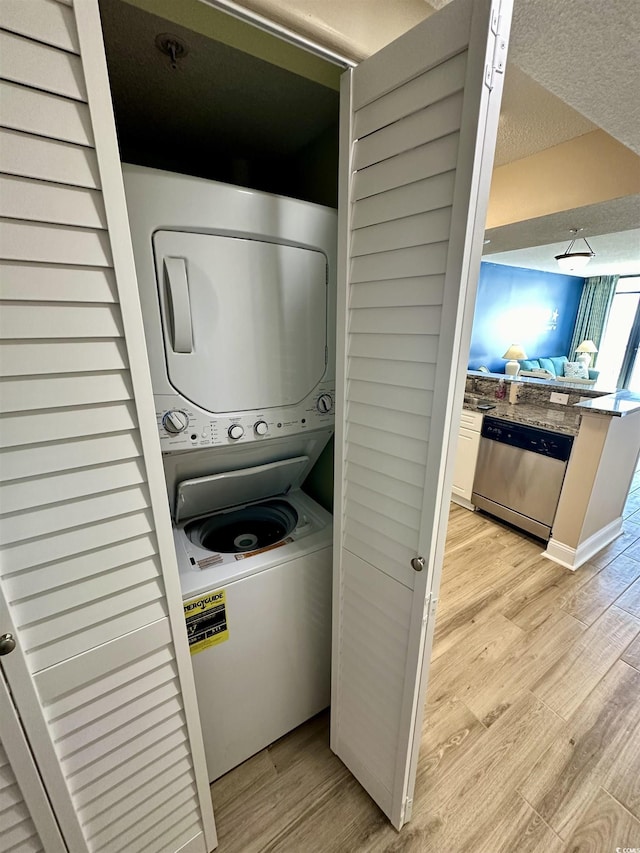 3000 N Ocean Blvd Unit 1406, Myrtle Beach, SC 29572 - laundry room with estacked washer and dryer and light wood-type flooring