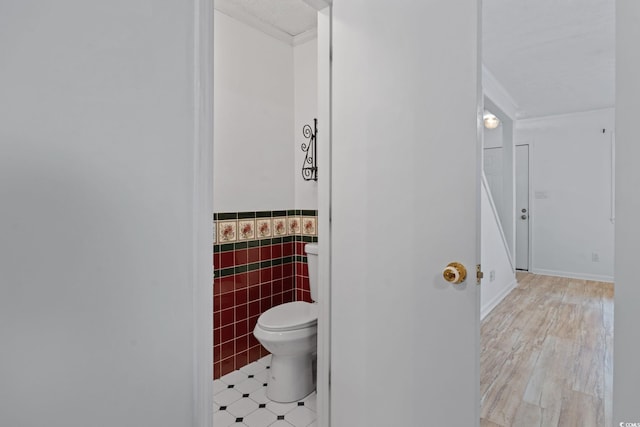 218 Waccamaw Village Dr Unit 218, Myrtle Beach, SC 29579 - half bath featuring toilet, ornamental molding, wainscoting, and tile walls