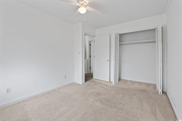 218 Waccamaw Village Dr Unit 218, Myrtle Beach, SC 29579 - unfurnished bedroom with carpet floors, ornamental molding, a closet, ceiling fan, and baseboards