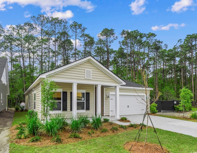 9724 Indigo Creek Blvd, Murrells Inlet, SC 29576 - view of front of house featuring concrete driveway, an attached garage, and a porch