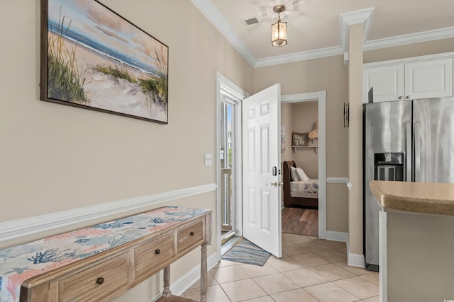 4890 Luster Leaf Cir Unit 201, Myrtle Beach, SC 29577 - foyer with crown molding, light tile patterned floors, and baseboards