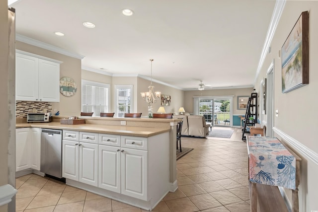 4890 Luster Leaf Cir Unit 201, Myrtle Beach, SC 29577 - kitchen featuring stainless steel dishwasher, a peninsula, open floor plan, ornamental molding, and white cabinets