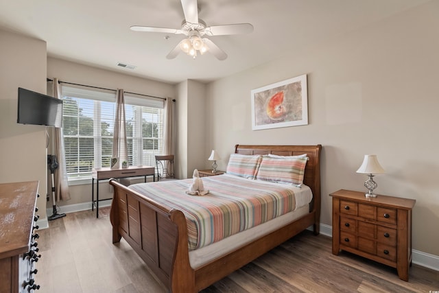 4890 Luster Leaf Cir Unit 201, Myrtle Beach, SC 29577 - bedroom featuring light wood finished floors, baseboards, and ceiling fan