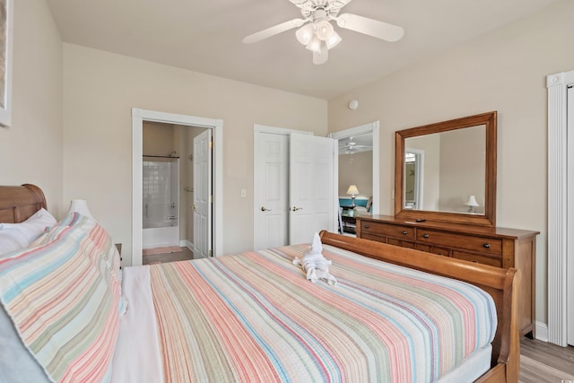 4890 Luster Leaf Cir Unit 201, Myrtle Beach, SC 29577 - bedroom featuring ensuite bath, baseboards, and ceiling fan
