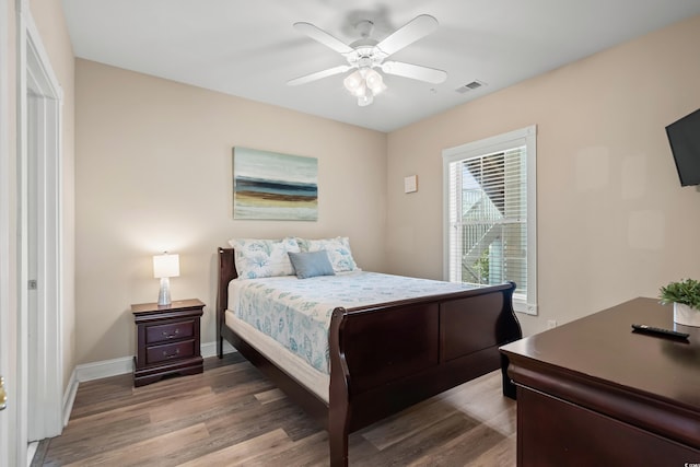 4890 Luster Leaf Cir Unit 201, Myrtle Beach, SC 29577 - bedroom with wood finished floors, baseboards, and ceiling fan