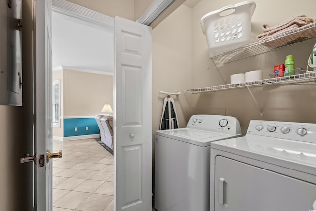 4890 Luster Leaf Cir Unit 201, Myrtle Beach, SC 29577 - washroom featuring independent washer and dryer, light tile patterned flooring, baseboards, and ornamental molding