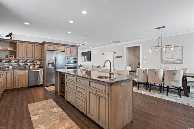 204 33rd Ave N, North Myrtle Beach, SC 29582 - kitchen featuring appliances with stainless steel finishes, a sink, an island with sink, dark stone counters, and open shelves