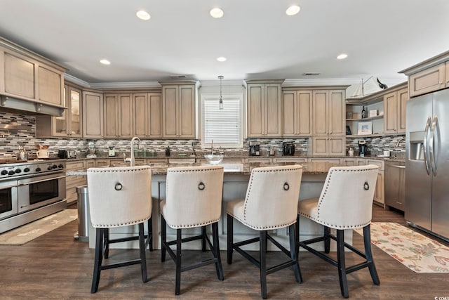 204 33rd Ave N, North Myrtle Beach, SC 29582 - kitchen with appliances with stainless steel finishes, a kitchen island, open shelves, backsplash, and light stone countertops