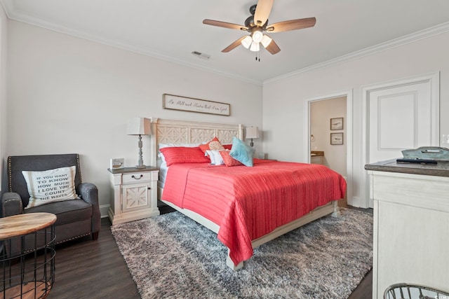 204 33rd Ave N, North Myrtle Beach, SC 29582 - bedroom with dark wood finished floors, crown molding, baseboards, a ceiling fan, and ensuite bath