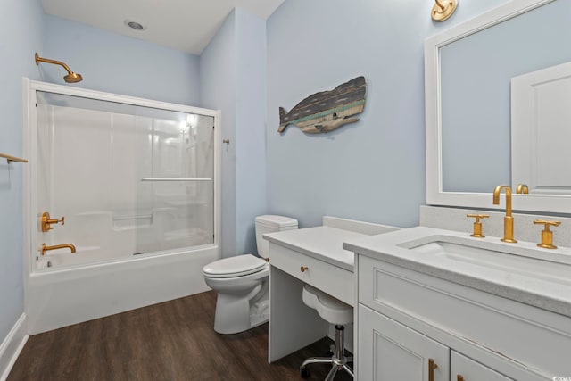 204 33rd Ave N, North Myrtle Beach, SC 29582 - bathroom with vanity, toilet, wood finished floors, and bathing tub / shower combination