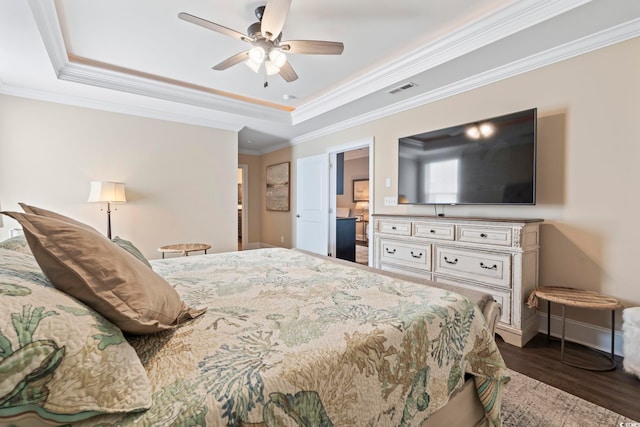 204 33rd Ave N, North Myrtle Beach, SC 29582 - bedroom featuring a raised ceiling, dark wood-style flooring, ornamental molding, baseboards, and a ceiling fan