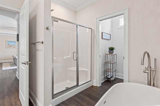 204 33rd Ave N, North Myrtle Beach, SC 29582 - bathroom featuring wood finished floors, crown molding, baseboards, and a stall shower
