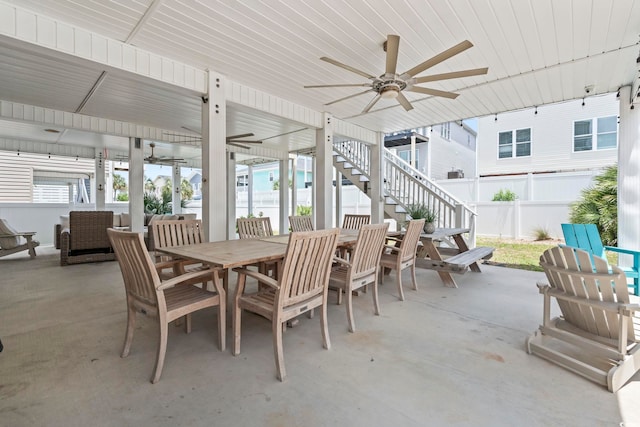 204 33rd Ave N, North Myrtle Beach, SC 29582 - view of patio with outdoor dining area, ceiling fan, and stairs