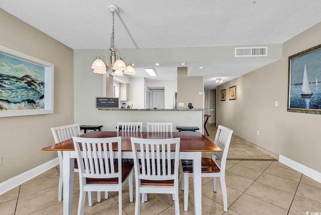 2511 S Ocean Blvd Unit 507G, Myrtle Beach, SC 29577 - dining space featuring light tile patterned flooring, baseboards, a chandelier, a textured ceiling, and recessed lighting