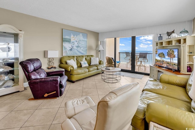 2511 S Ocean Blvd Unit 507G, Myrtle Beach, SC 29577 - living area featuring light tile patterned floors and a textured ceiling