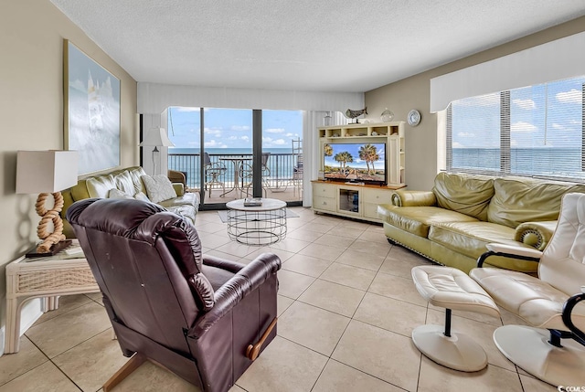 2511 S Ocean Blvd Unit 507G, Myrtle Beach, SC 29577 - living area with a textured ceiling and light tile patterned flooring