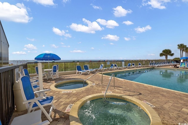 2511 S Ocean Blvd Unit 507G, Myrtle Beach, SC 29577 - community pool featuring a community hot tub and a patio