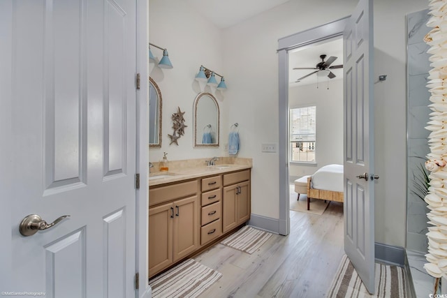 3477 Bristol Ln Unit 3477, Myrtle Beach, SC 29577 - ensuite bathroom with wood finished floors, double vanity, a ceiling fan, and baseboards