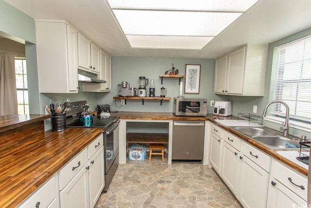 6610 Mallard View Pt, Myrtle Beach, SC 29588 - kitchen featuring stainless steel appliances, wooden counters, a sink, and under cabinet range hood