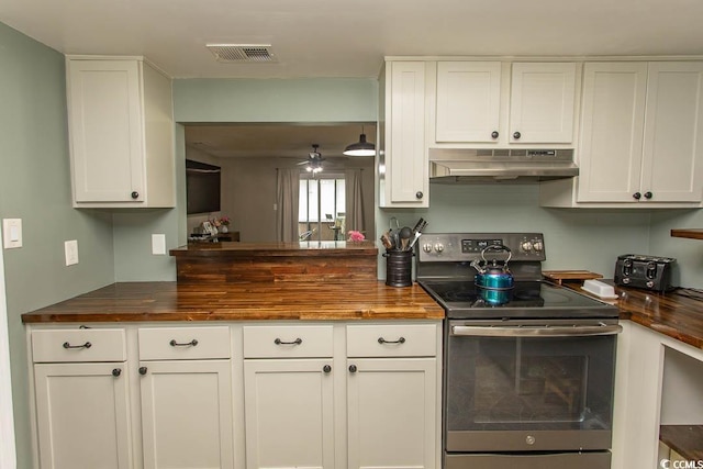 6610 Mallard View Pt, Myrtle Beach, SC 29588 - kitchen featuring under cabinet range hood, stainless steel range with electric stovetop, wooden counters, and white cabinets