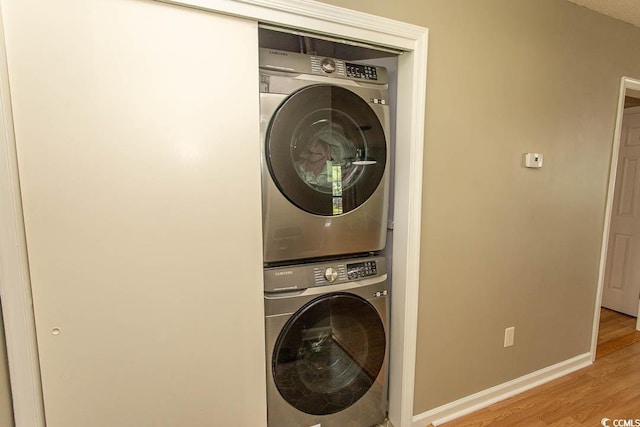 6610 Mallard View Pt, Myrtle Beach, SC 29588 - washroom with stacked washer / dryer, wood finished floors, and baseboards