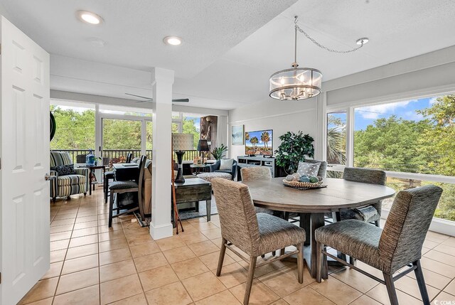 423 Parker Dr Unit 334, Pawleys Island, SC 29585 - dining space featuring light tile patterned flooring, recessed lighting, a chandelier, a textured ceiling, and a ceiling fan