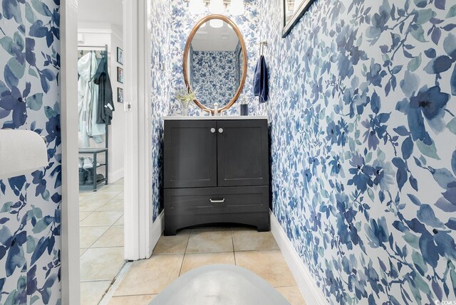 423 Parker Dr Unit 334, Pawleys Island, SC 29585 - bathroom featuring wallpapered walls, baseboards, vanity, and tile patterned flooring