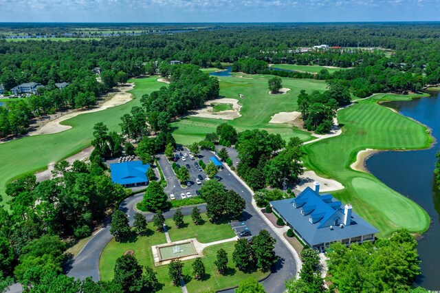 423 Parker Dr Unit 334, Pawleys Island, SC 29585 - drone / aerial view of a large body of water, a heavily wooded area, and a golf club
