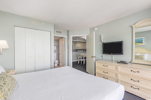 201 77th Ave N Unit 1133, Myrtle Beach, SC 29572 - carpeted bedroom with a closet and a textured ceiling