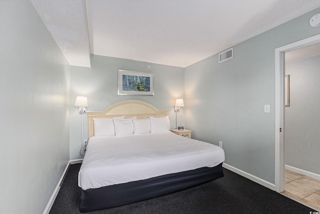 201 77th Ave N Unit 1133, Myrtle Beach, SC 29572 - carpeted bedroom with baseboards and a textured ceiling