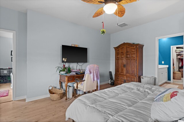 196 Cypress Tree Loop, Longs, SC 29568 - bedroom with baseboards, light wood-style floors, a ceiling fan, and ensuite bath