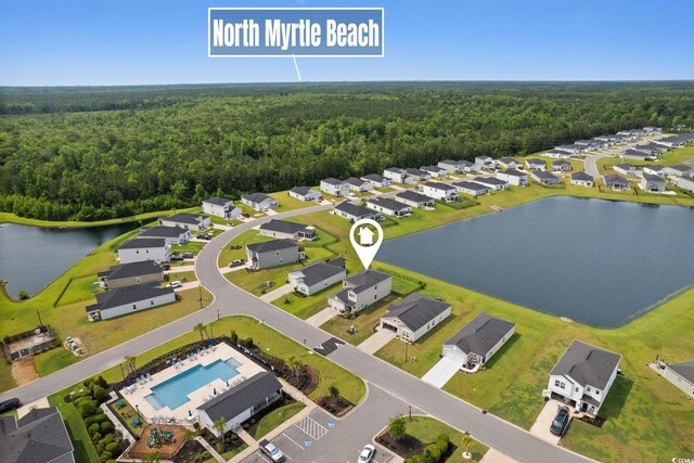 196 Cypress Tree Loop, Longs, SC 29568 - aerial perspective of suburban area featuring a heavily wooded area, a pool, and a nearby body of water