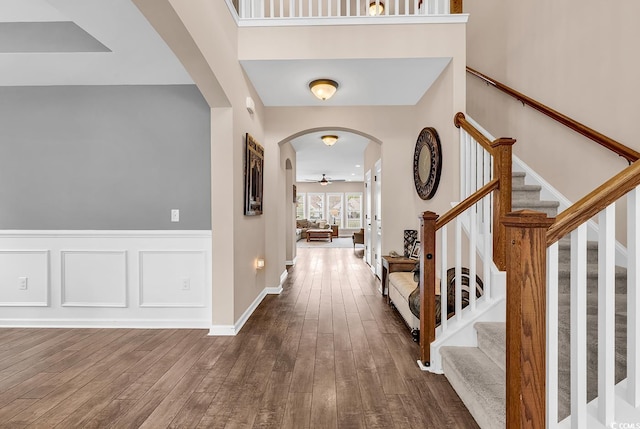1227 Cypress Shadow Ct, Murrells Inlet, SC 29576 - foyer with ceiling fan, arched walkways, stairway, and dark wood finished floors