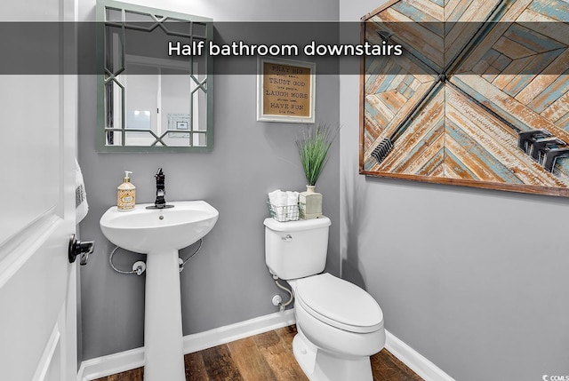 1227 Cypress Shadow Ct, Murrells Inlet, SC 29576 - bathroom with toilet, baseboards, and wood finished floors
