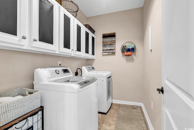 1227 Cypress Shadow Ct, Murrells Inlet, SC 29576 - washroom featuring washing machine and clothes dryer, baseboards, cabinet space, and light tile patterned floors