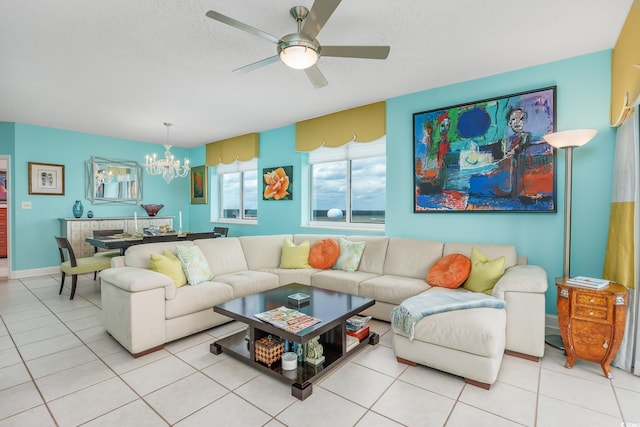 5700 N Ocean Blvd Unit Ph12, North Myrtle Beach, SC 29582 - living room with a chandelier, ceiling fan, light tile patterned floors, and a textured ceiling