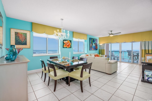 5700 N Ocean Blvd Unit Ph12, North Myrtle Beach, SC 29582 - dining room with healthy amount of natural light, a chandelier, ceiling fan, and light tile patterned floors