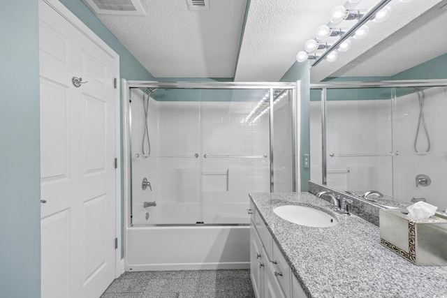 5700 N Ocean Blvd Unit Ph12, North Myrtle Beach, SC 29582 - bathroom featuring vanity, bath / shower combo with glass door, and a textured ceiling