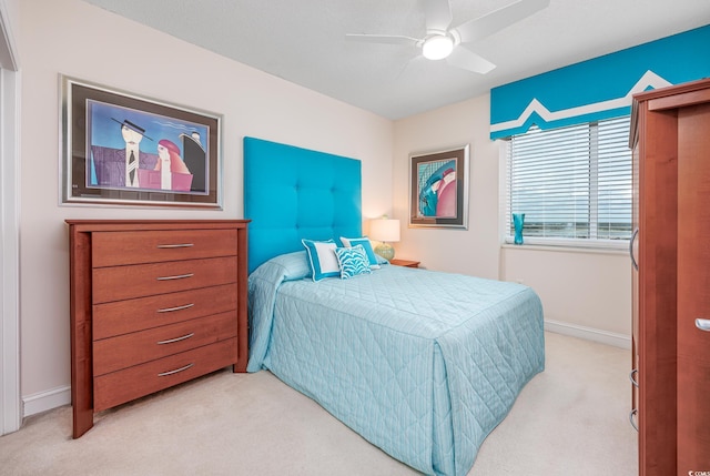 5700 N Ocean Blvd Unit Ph12, North Myrtle Beach, SC 29582 - bedroom with light colored carpet, baseboards, and ceiling fan
