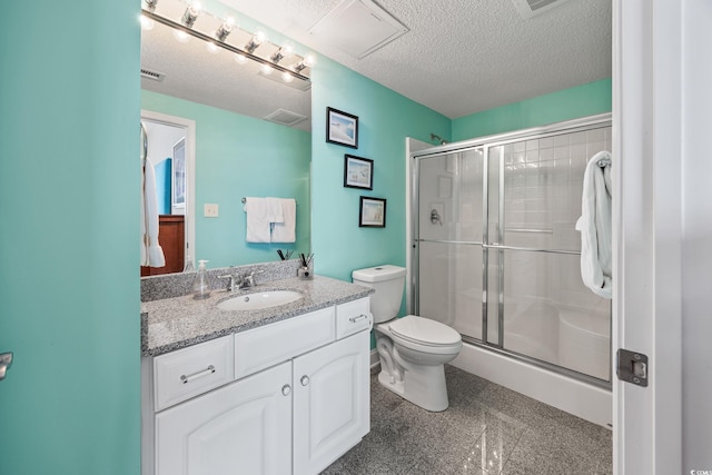5700 N Ocean Blvd Unit Ph12, North Myrtle Beach, SC 29582 - bathroom featuring toilet, a shower stall, vanity, a textured ceiling, and granite tiled floors