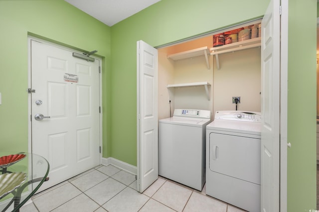 5700 N Ocean Blvd Unit Ph12, North Myrtle Beach, SC 29582 - washroom with washing machine and clothes dryer and light tile patterned floors