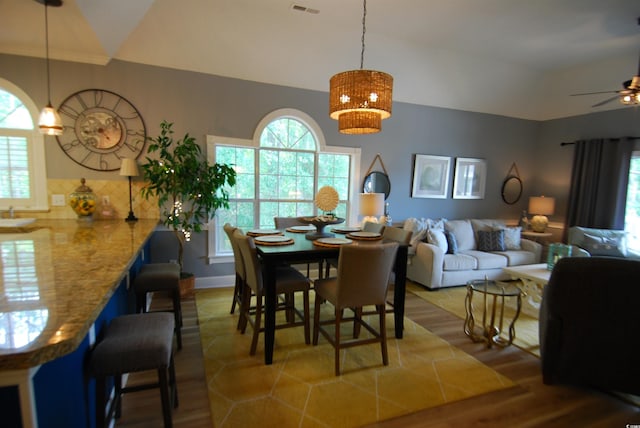390 Lands End Blvd Unit 4-201, Myrtle Beach, SC 29572 - dining room with vaulted ceiling, a ceiling fan, and wood finished floors