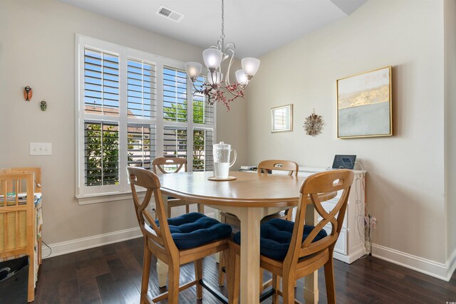 765 Berkshire Ave, Myrtle Beach, SC 29577 - dining area featuring baseboards, hardwood / wood-style flooring, and a chandelier